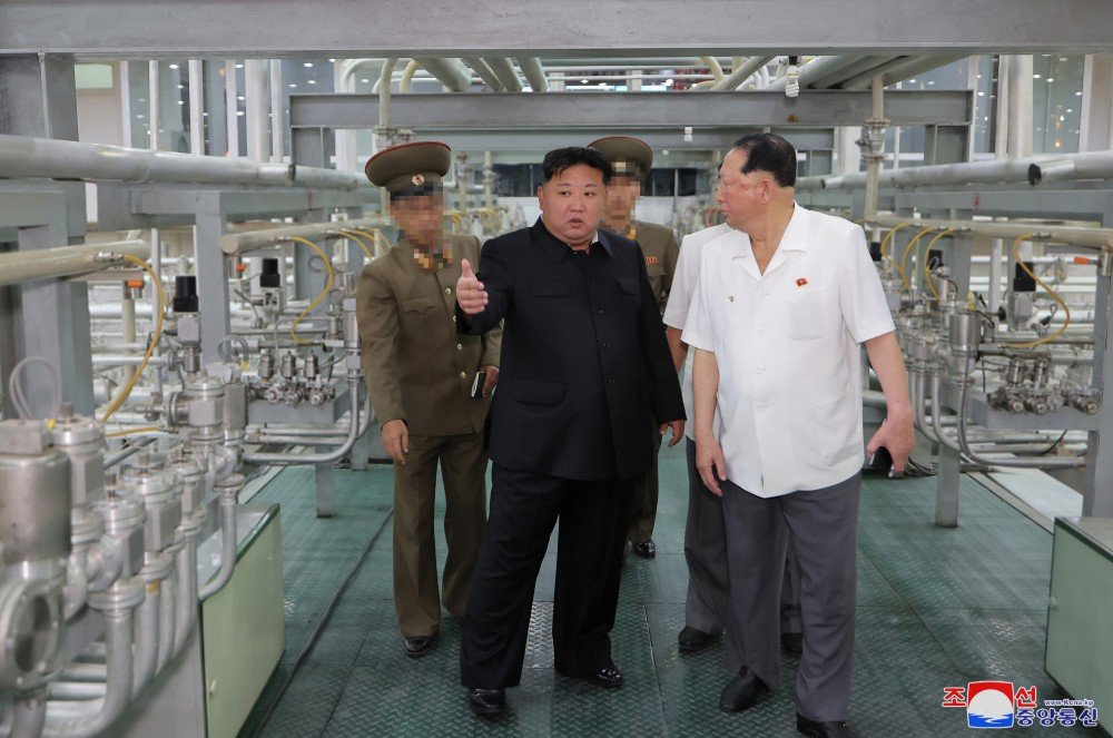 North Korea releases rare photos of Kim at uranium facility